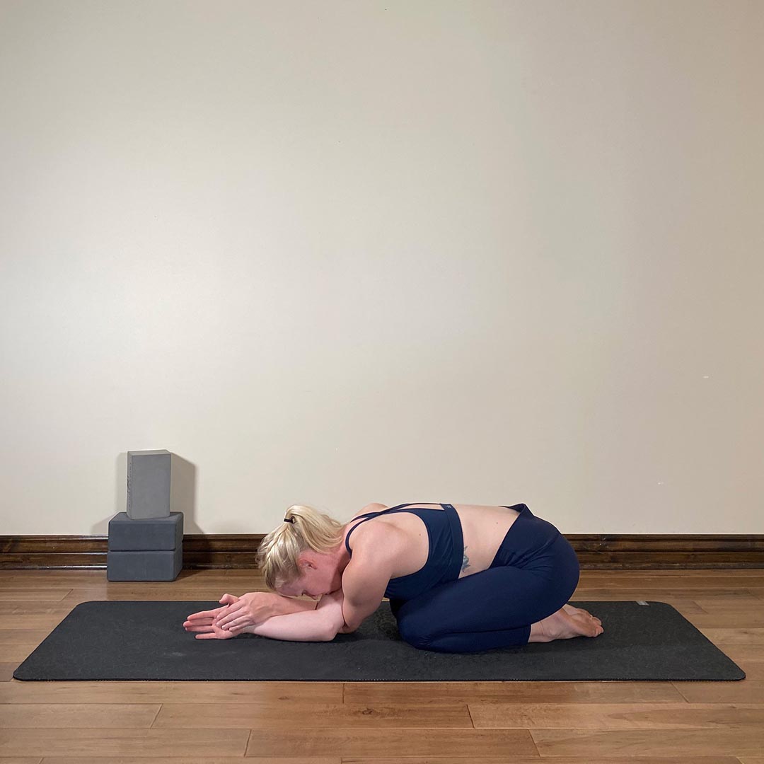 Eagle Hands in Child's Pose, Hasta Garudasana in Balasana